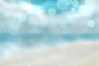 © Olga - Abstract beach background. Abstract bright tropical sand beach with blue sky and white clouds and waves. Backdrop for summer holidays and travel advertising.