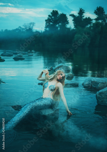 Pretty Cute Mermaid Girl With Long Blond Hair And Silver Scaly