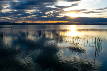 Orange sunset on the lake of the Albufera in Valencia, Spain