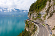 © robertharding - A curved road built into the side of a mountain next to Lake Thun, Interlaken, Bernese Oberland, Bern