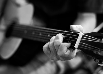 Senior man playing on his guitar