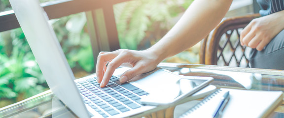 Woman hands working with laptop computer in  the office.