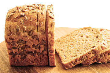 Rye bread on a white background. Rye bread with sunflower seeds. Close-up.