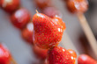 Tanghulu traditional Chinese hard caramel coated strawberry skewers close-up also called bing tanghulu candied hawthorn sticks
