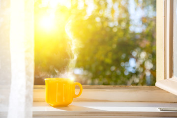 Good morning! Cup on the window with sun