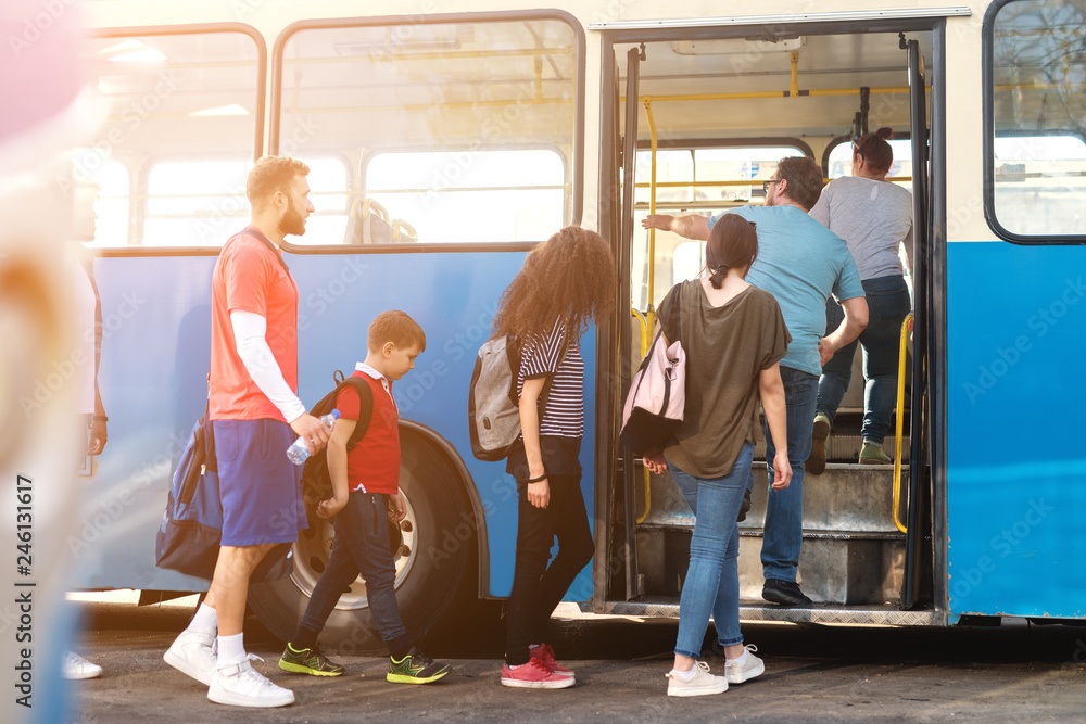 People Using Transport Group of people entering public transportation. Stock Photo | Adobe Stock