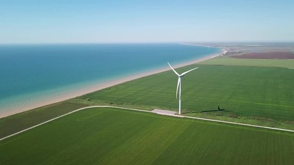 Wall Mural - Aerial view at wind power station on field. Technology and inovation. Green energy composition. Wind turbines. Industrial landscape