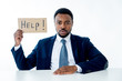© SB Arts Media - Young Businessman Holding Cardboard With Help Text At Workplace in stress and pressure at work.