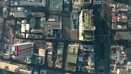 Wall Mural - Aerial city view of Bangkok with crossroads and roads, houses, buildings and parking lots. Helicopter drone shot.