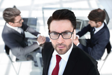 Wall Mural - confident businessman on the background of the office