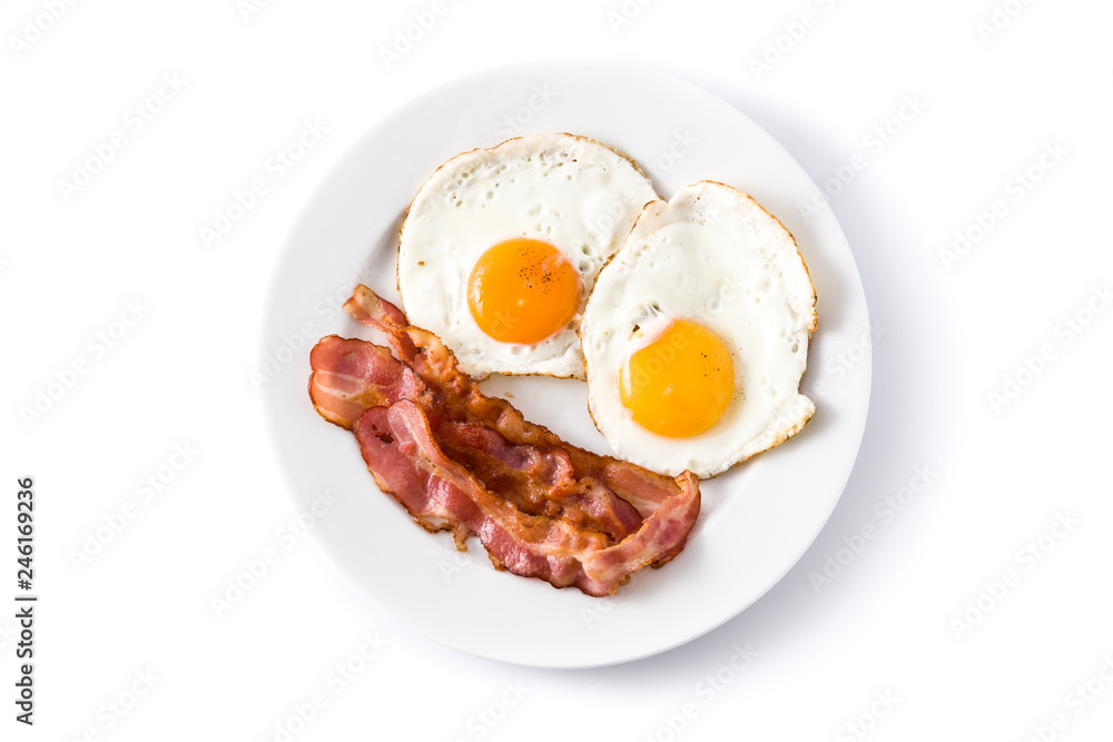 Fried eggs and bacon for breakfast isolated on white background. Top ...