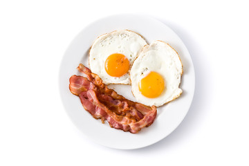 fried eggs and bacon for breakfast isolated on white background. top view
