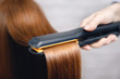 © Parilov - Hair straightening iron in beauty salon