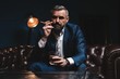 © opolja - Attractive man with cigar and a glass whiskey