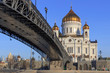 Cathedral of Christ the Saviour on a background of Patriarshiy Bridge at sunny spring morning