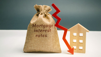 Wall Mural - Bag with the money and the word Mortgage interest rates and arrow to down and house. Low interest in mortgages. Reducing interest payments for mortgages. The fall in housing rates on credit. 