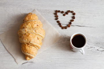 Wall Mural - croissant and heart shaped coffee beans