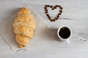 Wall Mural - croissant and heart shaped coffee beans