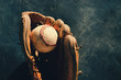 © ccestep8 - Baseball in old leather glove, shows ball and mitt for sports equipment with copy space.