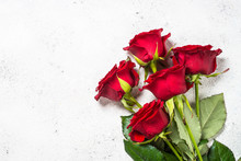 Red Roses Flower Bouquet On White Background Top View. 
