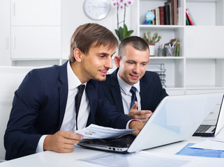 two young managers in office.