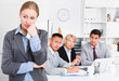 © JackF - Business woman crying in office with working colleagues