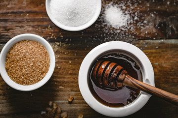 Wall Mural - different kinds of sugar and maple syrup on a background