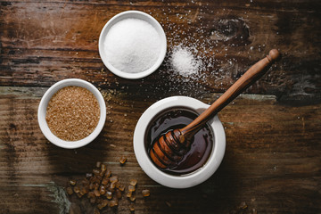 Wall Mural - different kinds of sugar and maple syrup on a background
