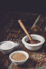 Wall Mural - different kinds of sugar and maple syrup on a background