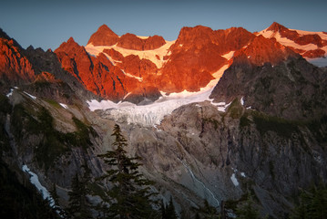 Curtis Glacier at the Foot of Imposing Mount Shuksan. Lower Curtis Glacier is in North Cascades National Park in the state of Washington. The glacier is on the western slopes of Mount Shuksan.