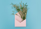 Green flowers with pink envelope