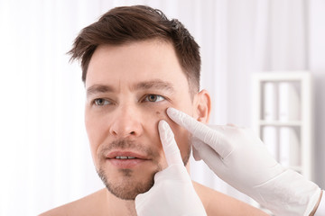 Wall Mural - Doctor examining patient in clinic. Visiting dermatologist