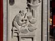 Fine ancient relief on a stone wall showing traditional chinese cooker how to make steamed buns.