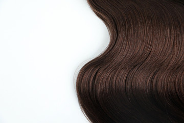 Lock of beautiful healthy brown hair