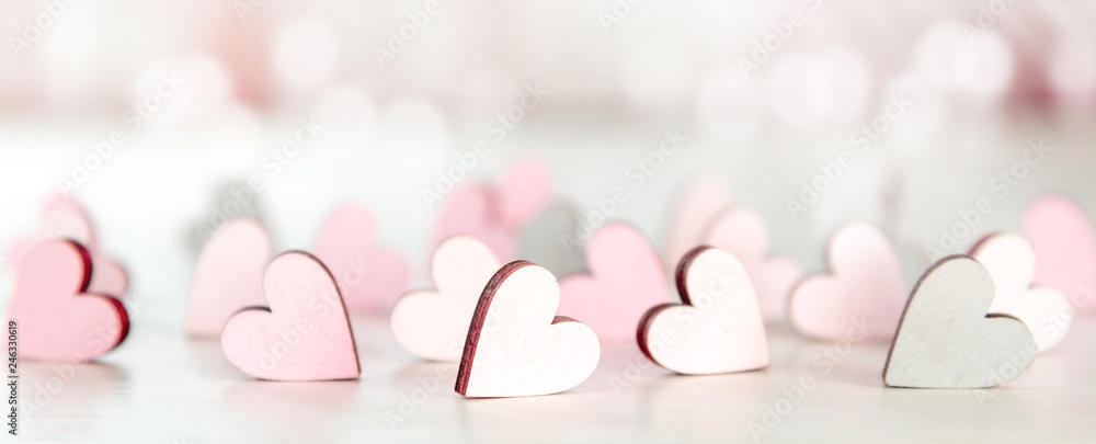 Backround or banner for valentines day, mothers day with hearts and bokeh in light pink - obrazy, fototapety, plakaty 