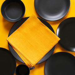 Poster - Set of black tableware on yellow