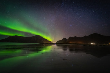 lofoten aurora above moutains stars sea