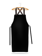 Wall Mural - Black kitchen apron on hanger. Chef uniform for cooking vector template.