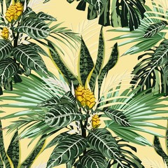  Summer Hawaiian seamless pattern with many types of palm leaves and exotic yellow flowers. Botanical wallpaper, Hawaiian style. Yellow backdrop.