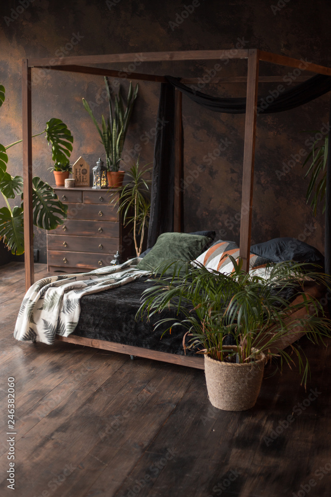 loft style dark bedroom with green plants and textured wall Stock Photo |  Adobe Stock