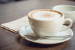 © 3asy60lf - Hot coffee and hot tea place on the wooden table in early morning with copyspace, white cup and silver spoon.