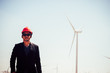 © arrowsmith2 - Portrait of engineer asian man holding notebook with the wind turbine in background.