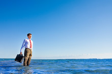 Young Office White Collar Worker Stand In The Sea