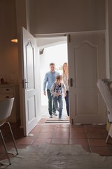 Happy family entering in home