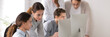 © fizkes - Horizontal photo female mentor explain intern corporate software online task point at pc screen, assistance and help concept. Horizontal photo banner for website header design with copy space for text