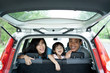 © Odua Images - happy family smile and laugh in car