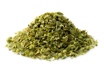 A pile of dried chopped oregano isolated on white.