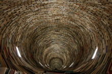 A Picture Of A Tunnel Made Of Books. Looking Quite Hypnotic. It Is Made Of Books And Mirrors. 