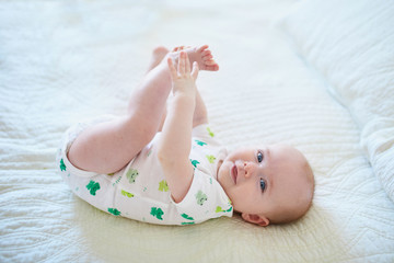 Wall Mural - Cute baby girl lying on her back