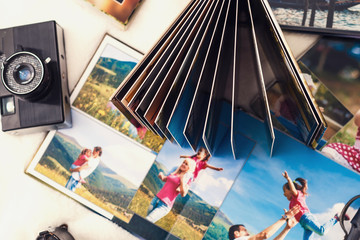 Wall Mural - Photo album with photos of travel and vintage old camera